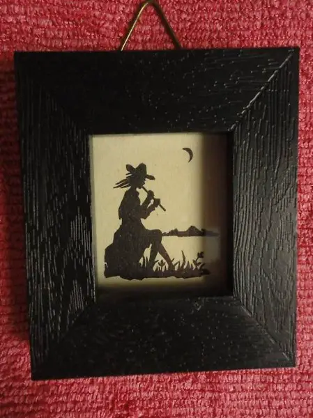  Scherenschnitt, der Flötenspieler