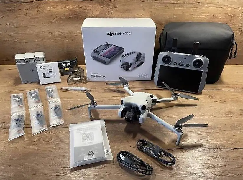 DJI Mini 4 Pro Fly More Combo RC2 Drohne - Höhe 500m mit Zub
