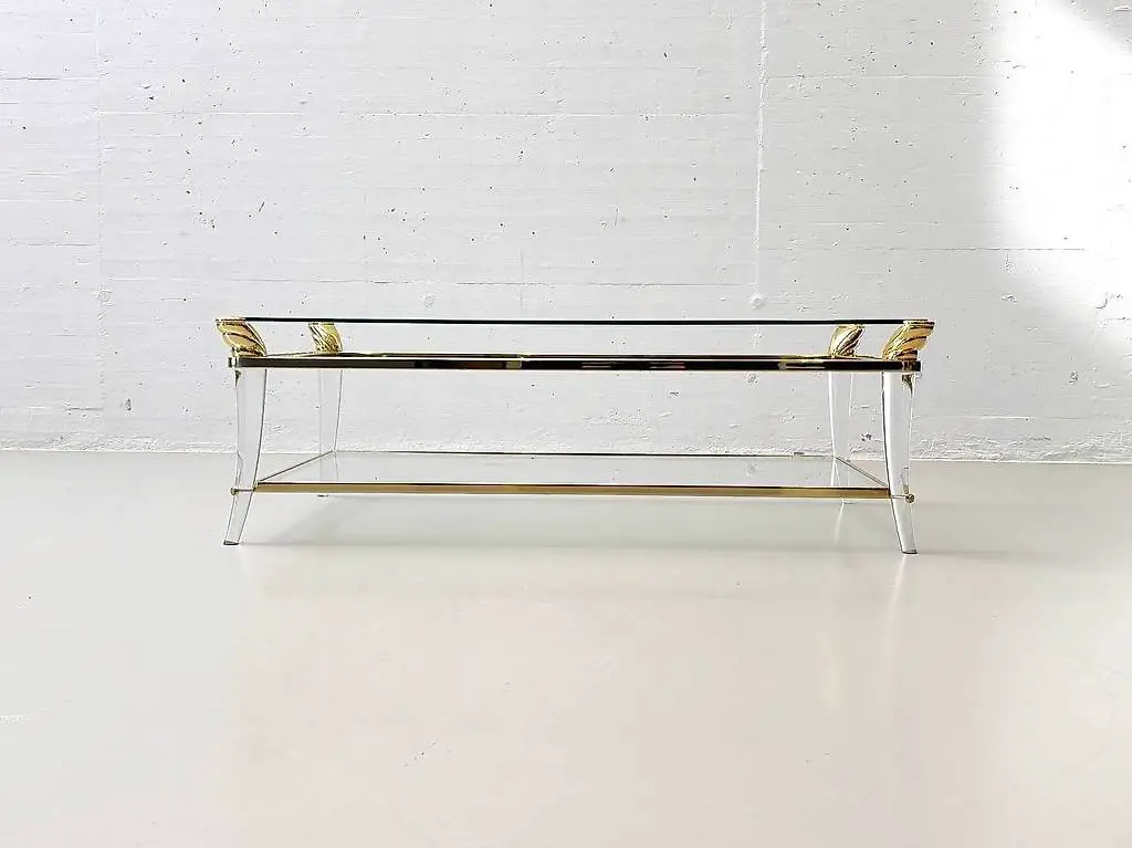 Couchtisch aus Glas mit goldenen Elementen