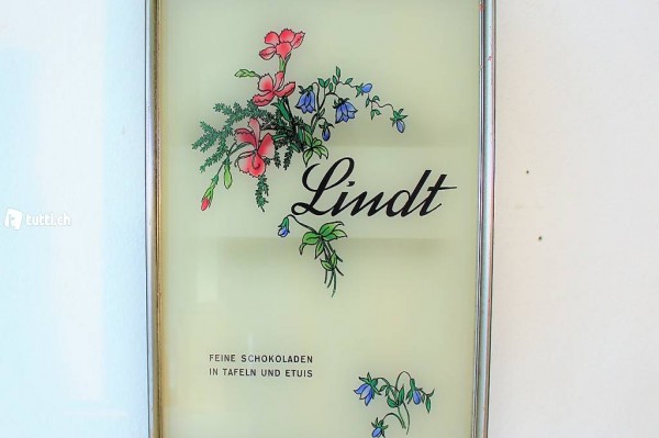 Werbetafel von Lindt, eingerahmt