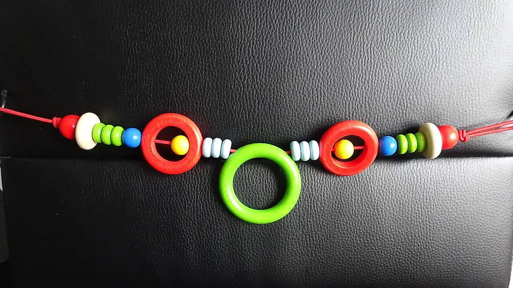 Kinderwagenkette neu, Greifspiel