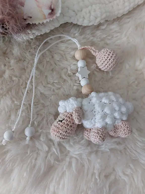 Spielbogen / Maxi Cosi Anhänger mit Rassel