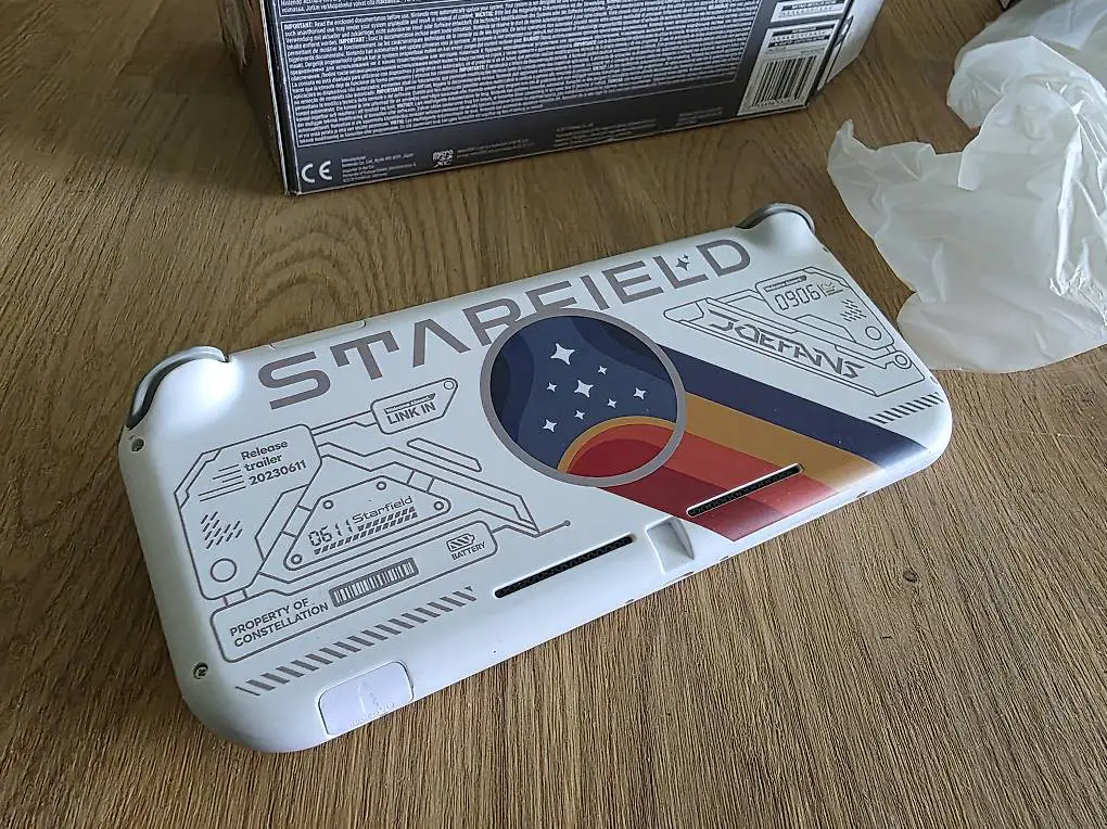 Nintendo Switch Lite Grau + Starfield Design, Top Zustand