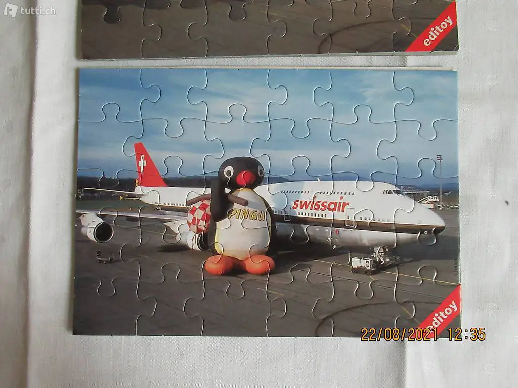 Pingu, PINGU, bei der Swissair, SWISSAIR, Flugzeug