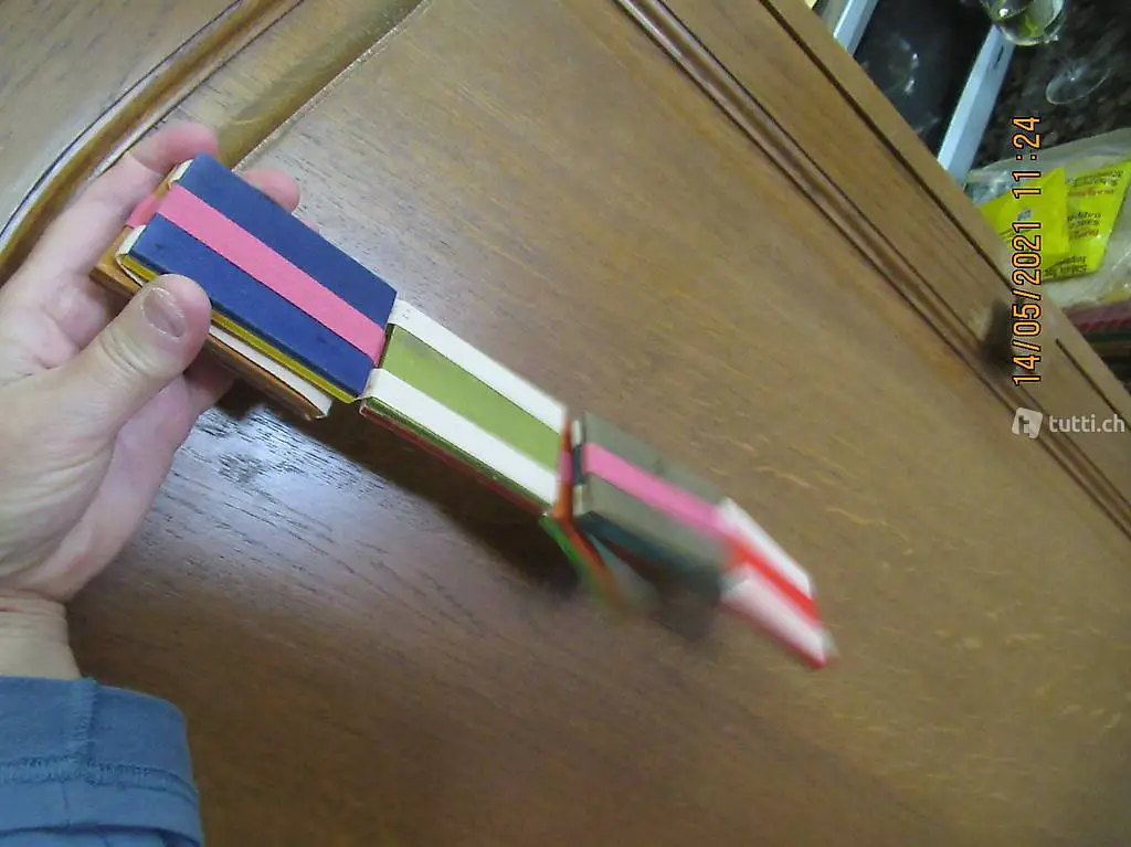 Klapperschlange, Holzspiel das immer eine Scheibe fallen läs