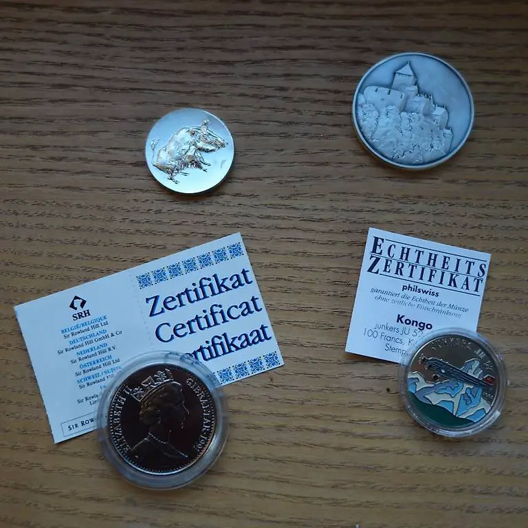 4 Münzen (Gibraltar, Flugzeug Ju, Tierpark Langenberg, Liba)