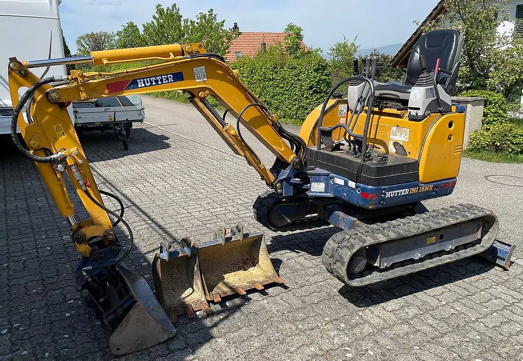 Hutter Bagger IHI 15 NX mit Holzspalter anschluss