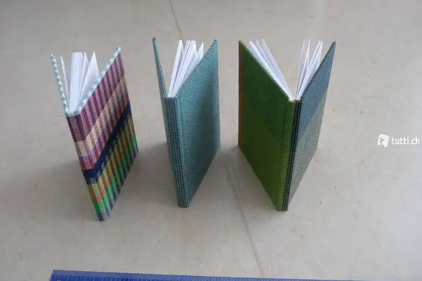 Vier Notizbücher Stoff