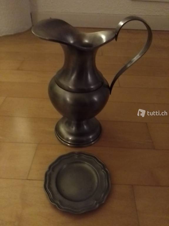 Zinnkrug und 6 Unterteller