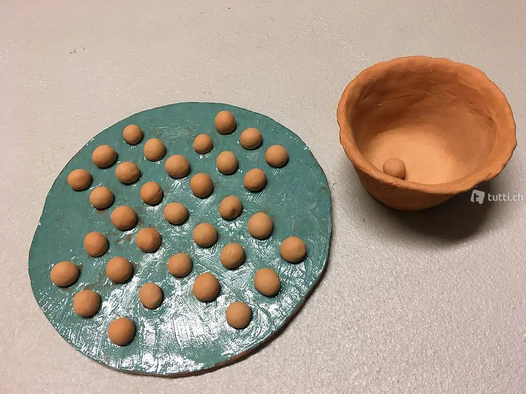 Schweizerkreuz Spiel mit Murmeln