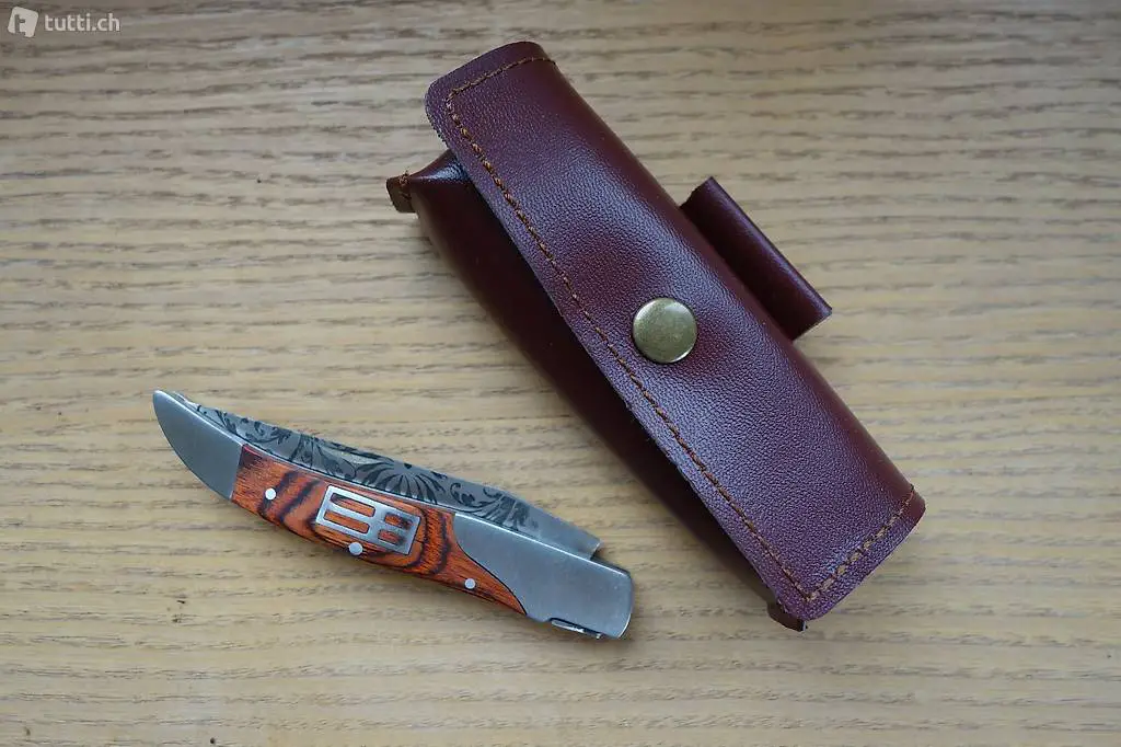 Klappmesser (rostfr.graviert.Stahl) silberfarb. m.Etui, neu