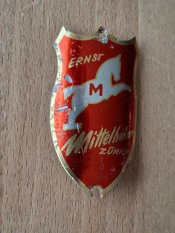 Ernst Mittelholzer Steuerkopf CH Schild Emblem