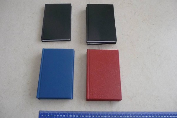 Notizbücher schwarz, blau, rot
