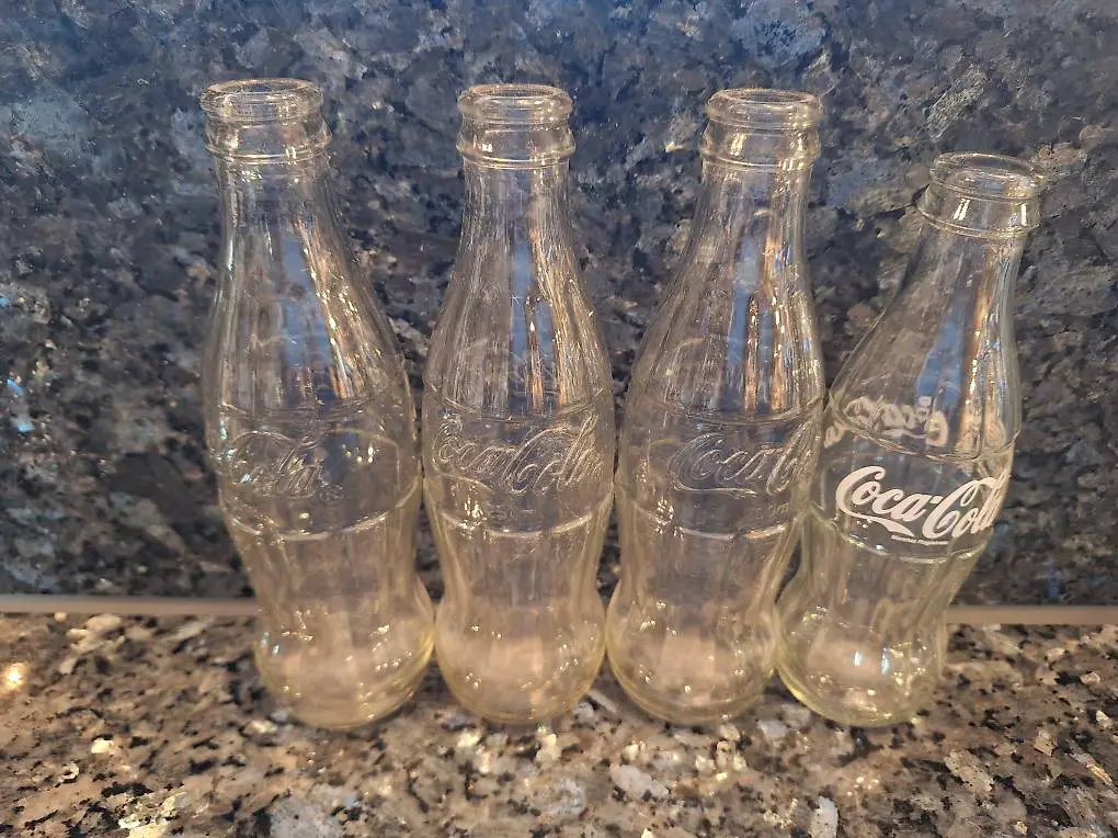 4 alte Coca Cola Flaschen