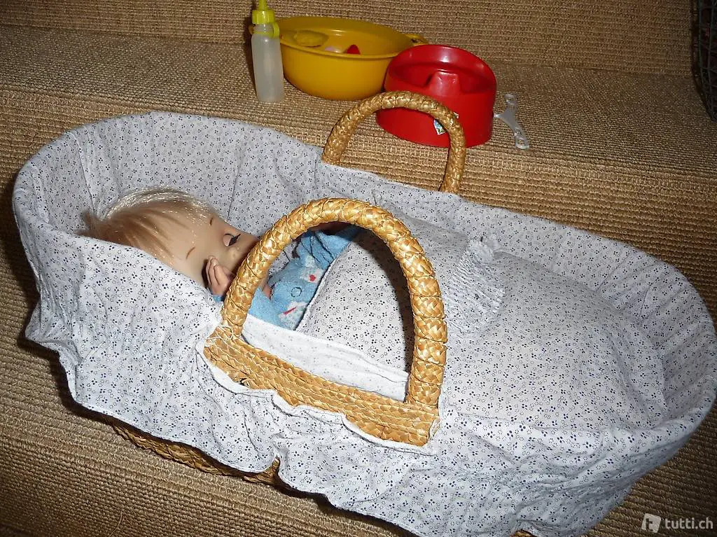 Puppe mit Moseskörbli