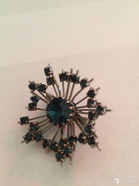 Vintagebrosche Silberfarbenes Gerüst mit blauen Steinen